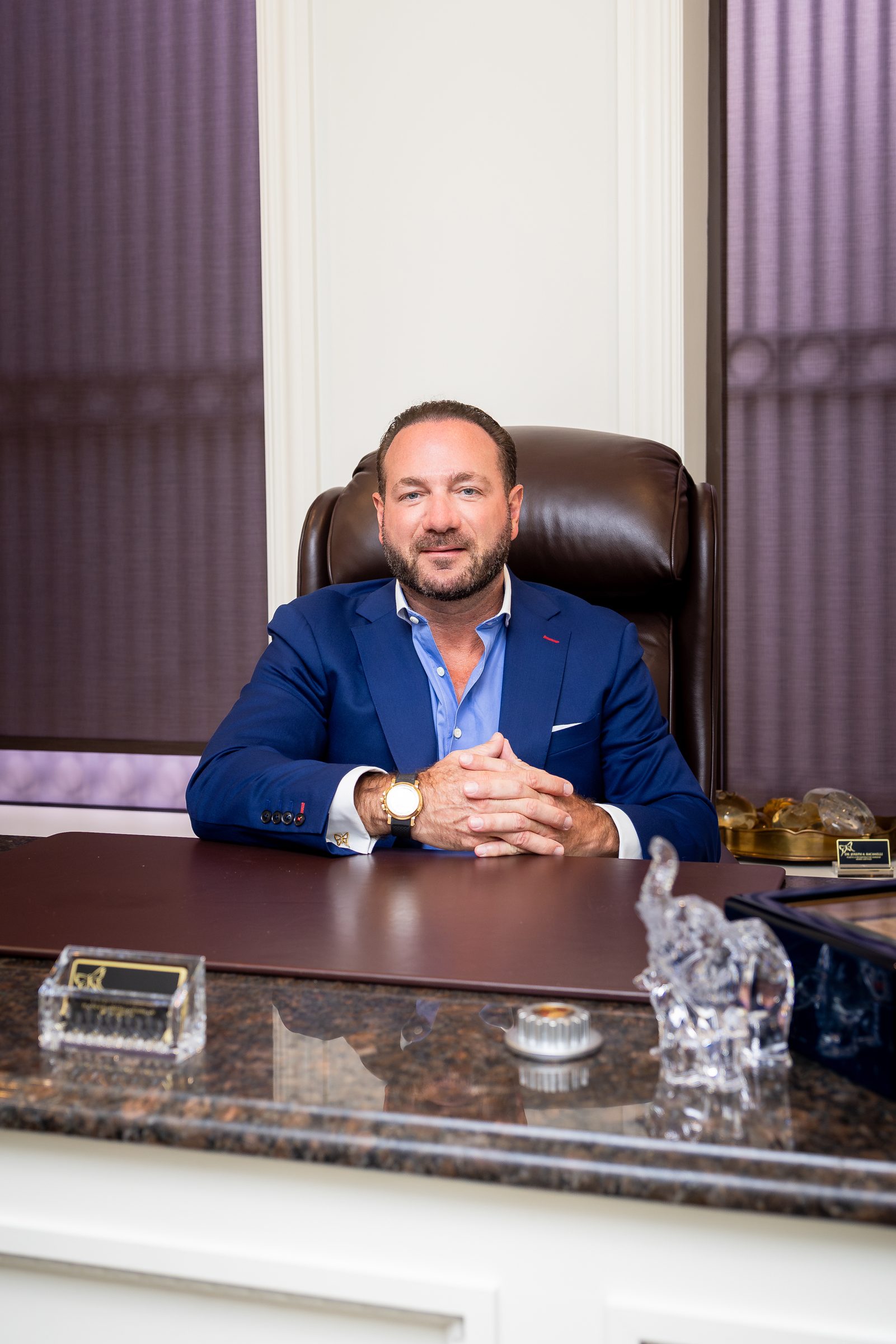 Portrait of Dr. Joseph Racanelli at his desk in his New Jersey office