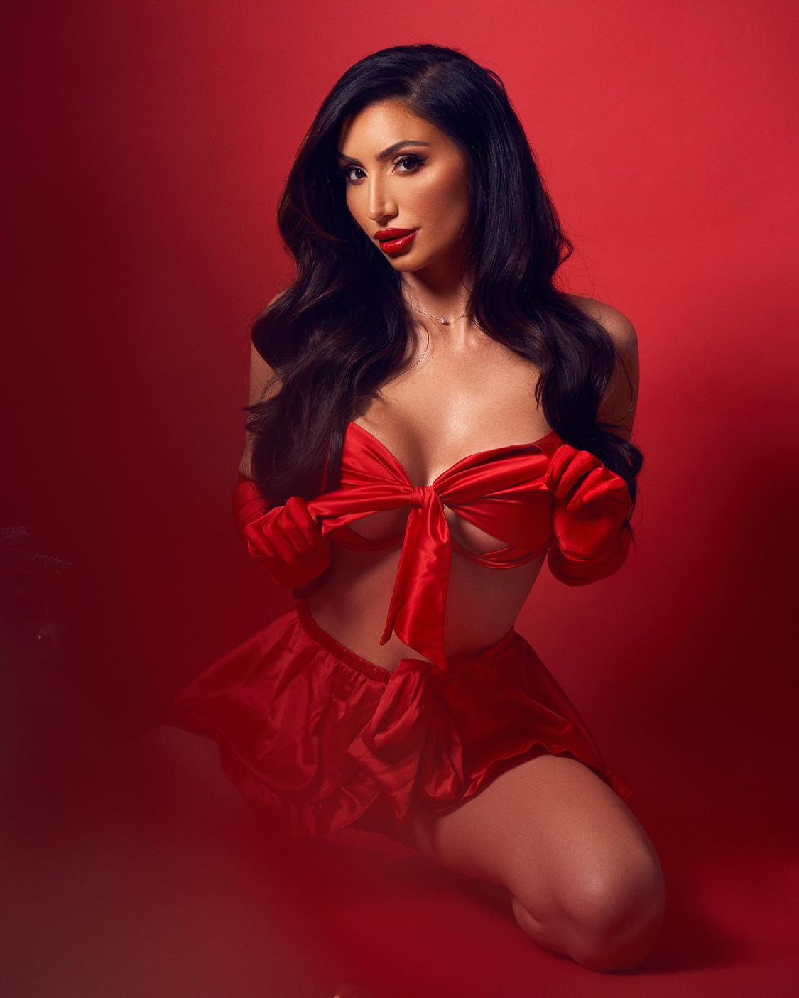 model after her breast augmentation in Christmas lingerie