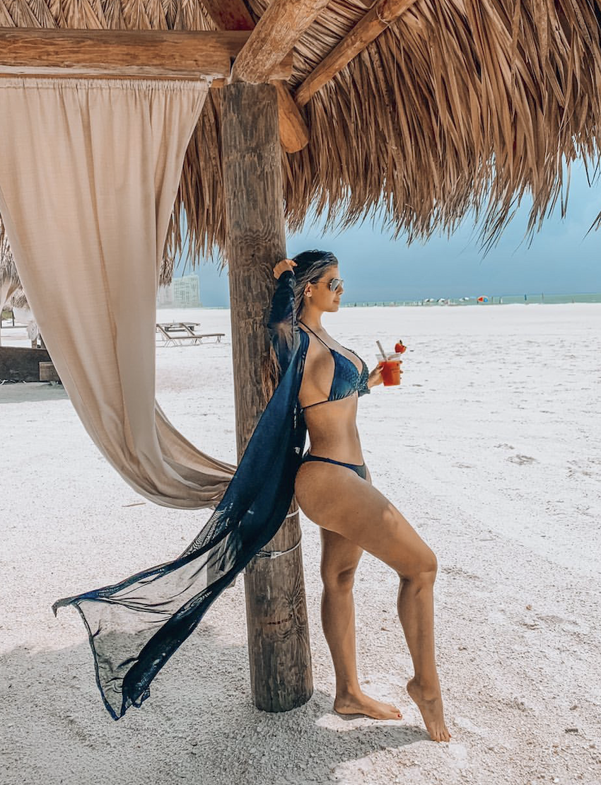 Woman showing a defined waist and abdominal contour after VASER Hi Def liposuction