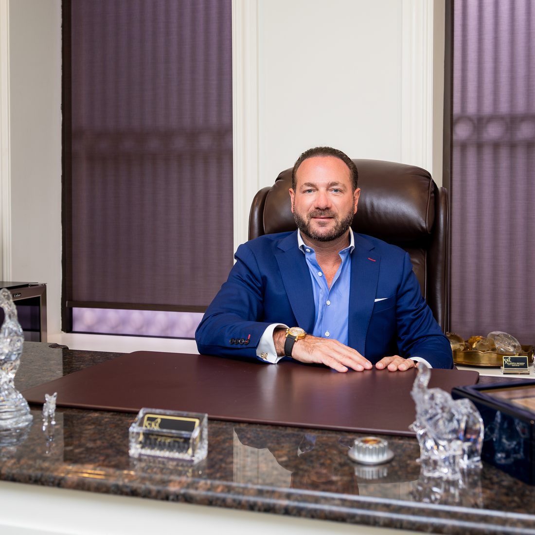 Dr. Joseph A. Racanelli, who performs every tummy tuck personally, at his desk
